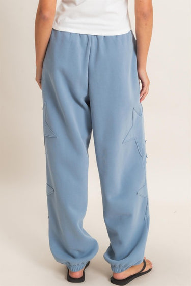 HYFVE Starstruck appliqué lounge pants in dusty blue, featuring star designs and a comfortable relaxed fit.
