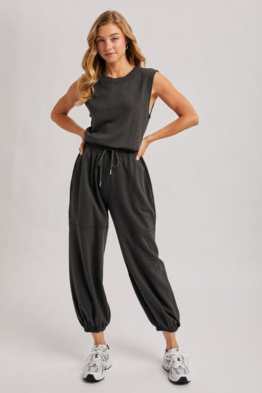 Washed black sleeveless jogger jumpsuit by blueivy, relaxed fit with drawstring waist, one-piece skirt with casual style.