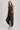 Washed black sleeveless jogger jumpsuit by blueivy featuring relaxed fit, drawstring waist, and casual skirt design.