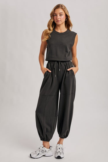 Blueivy Washed Black Sleeveless Jogger Jumpsuit with relaxed fit, drawstring waist, and skirt-style design, shown in the product image.