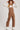 Women’s brown barrel leg overalls by blueivy featuring western-style cowgirl jumpsuit with stylish pockets and adjustable straps.