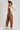 Women’s brown barrel leg overalls by blueivy, Western cowgirl jumpsuit with rustic charm, featuring adjustable straps and functional pockets.