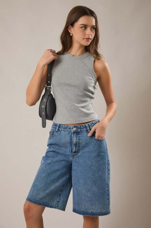 LE LIS sleeveless rib tank top, close-up of soft, fitted fabric with ribbed texture and sleeveless design.