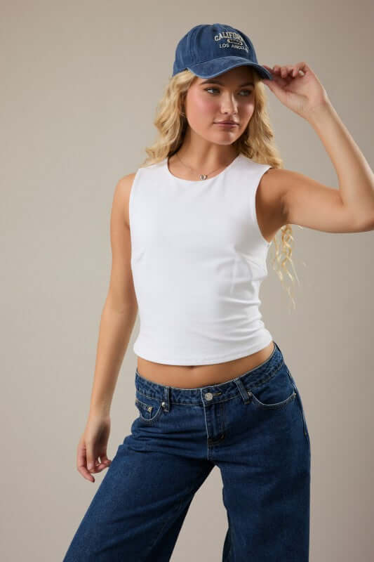 Double lined sleeveless round neck top by LE LIS, shown in a neutral color, highlighting the soft fabric and sleeveless design.