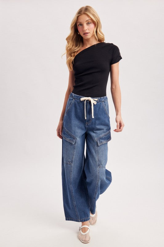 Draped asymmetric one-shoulder knit top by Cowgirl Charm, featuring a stylish drape and unique design in soft knit fabric.
