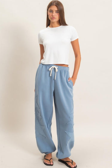 HYFVE Starstruck appliqué lounge pants in dusty blue with star design and relaxed fit, comfortable for casual wear.