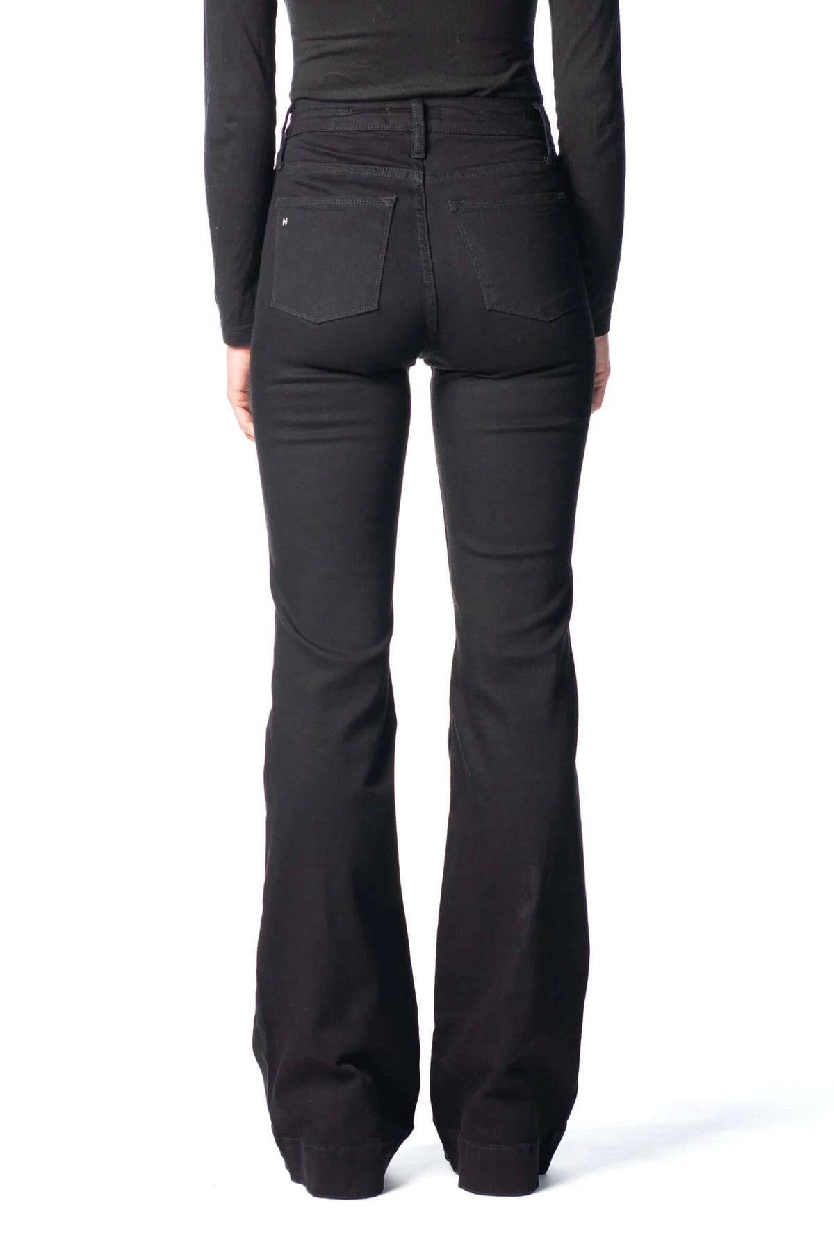 Haala Denim Bella flare trousers in black with black stitching, showcasing the stylish high-waist design and fitted silhouette.