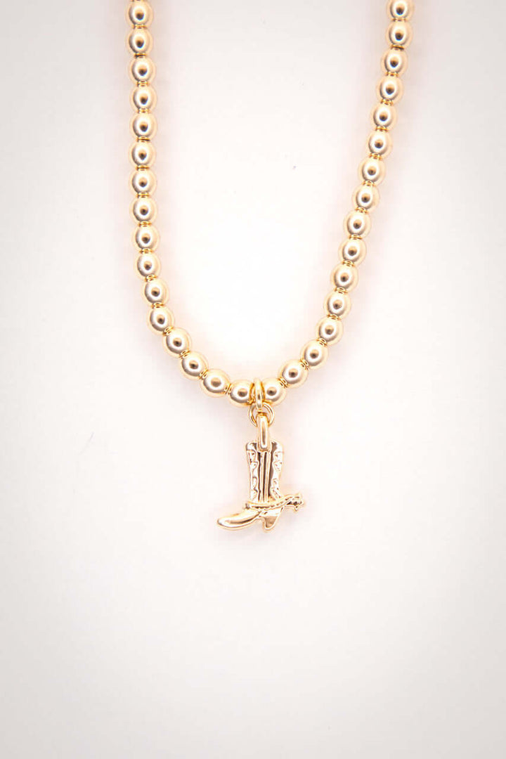 14-inch gold-plated beaded necklace with cowboy boot charm by West & Co., featuring delicate beads and Western-inspired design.