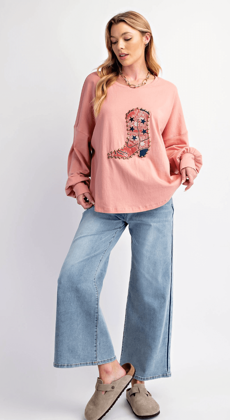 Easel jersey knit top with boots patch detailing, long sleeves, and a relaxed fit, perfect for casual wear.