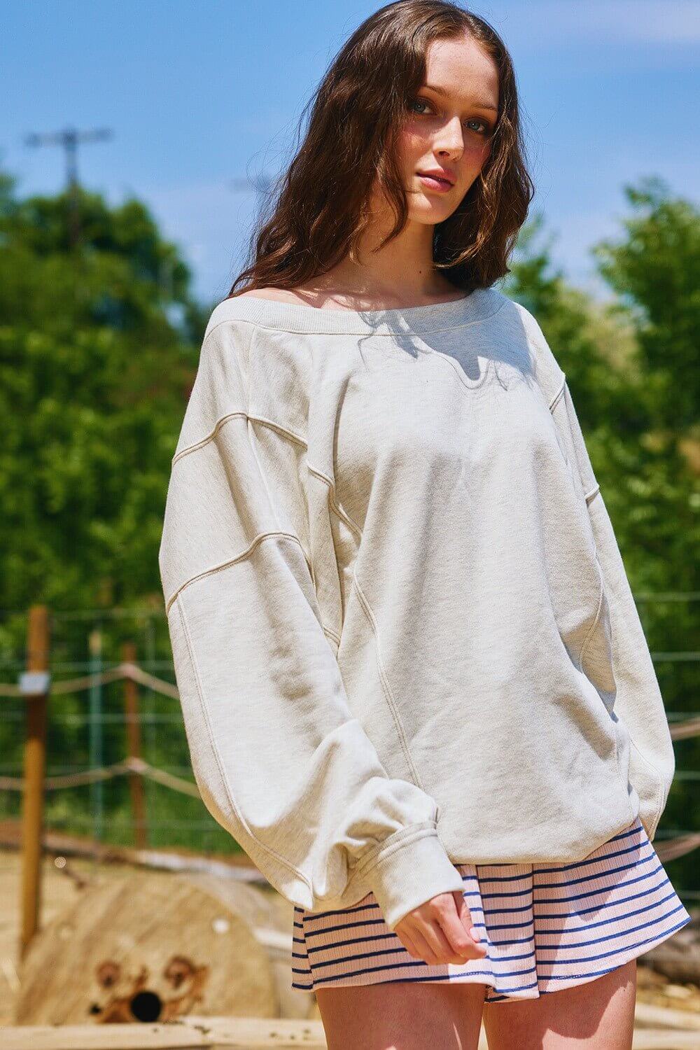 Bucketlist reversible twist-front washed terry sweatshirt top, graphic sweatshirt with casual, cozy style and unique design details.