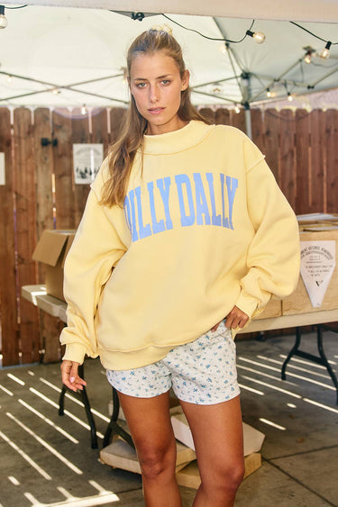 Black Dilly Dally mockneck sweatshirt by BUCKETLIST INC, featuring a relaxed fit and soft fabric, displayed on a hanger.