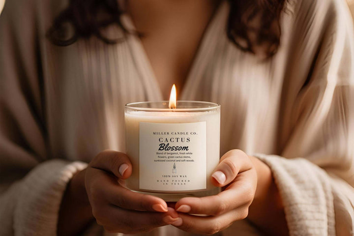 Miller Candle Co. cactus blossom candle in a whiskey glass, decorative home candle with floral scent, on a wooden surface