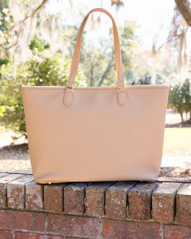 Caroline Hill oversized tote bag made of vegan leather, featuring zipper closure, suitable for work, travel, and everyday use.