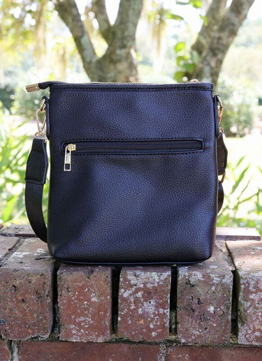 Caroline Hill vegan leather crossbody bag with adjustable strap, lightweight travel purse, compact and stylish for everyday use.