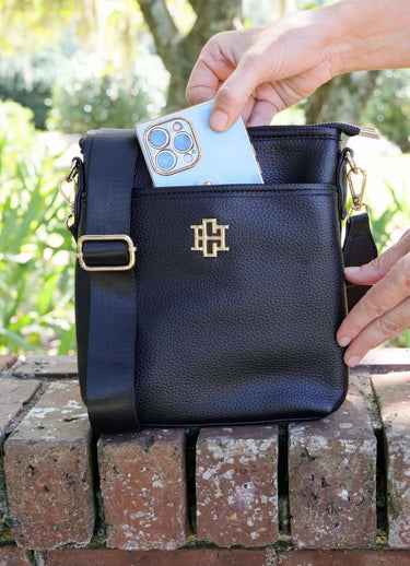 Caroline Hill vegan leather crossbody bag with adjustable strap, lightweight travel purse, sleek and stylish for everyday use.