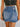 Denim high waist wrapped mini skirt by 1 the Woman, featuring a fitted silhouette and stylish design, shown on a model.