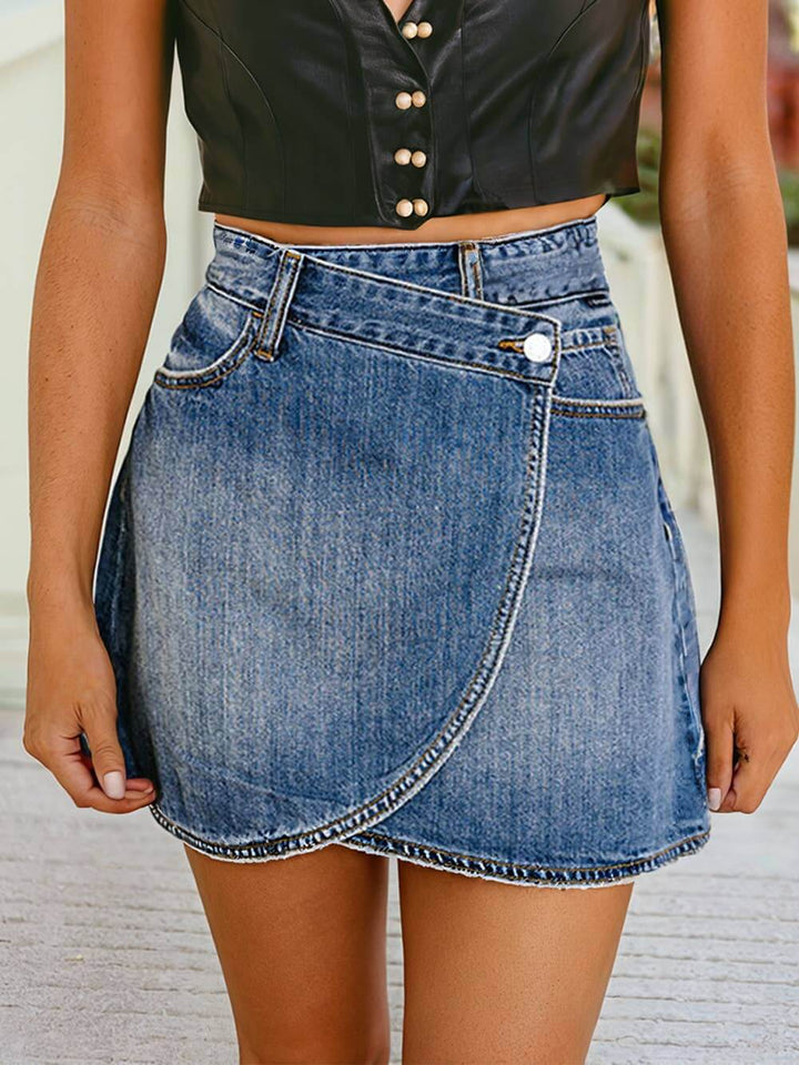 Denim high-waist wrapped mini skirt by 1 the Woman, featuring a stylish fit and classic blue denim fabric.