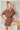 Day + Moon denim romper with flap pockets and wrap front detail, featuring a casual jumpsuit design and stylish denim fabric.