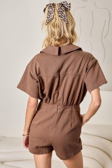Day + Moon denim romper featuring flap pockets and a wrap front design, perfect for casual and stylish summer wear.