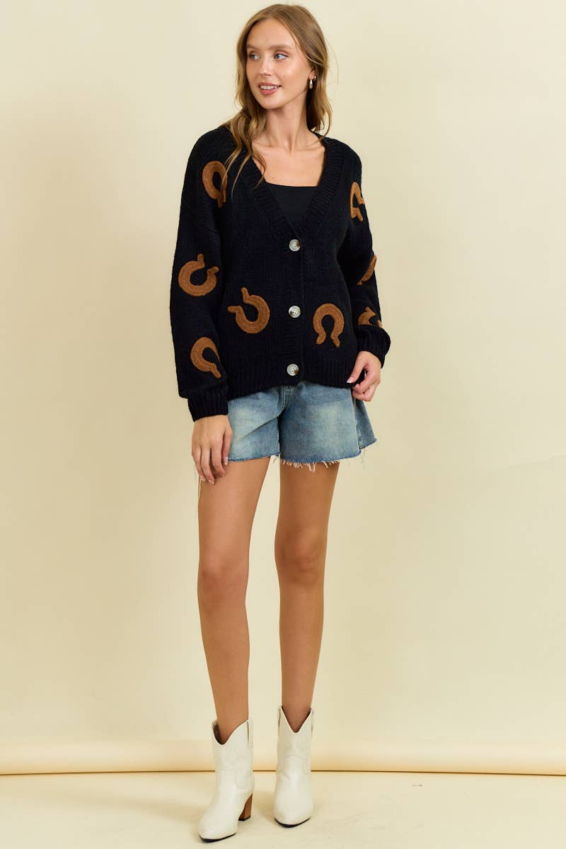 Doe and Rae horseshoe patch cardigan, cozy knit sweater with decorative horseshoe patches, long sleeves, and ribbed cuffs.