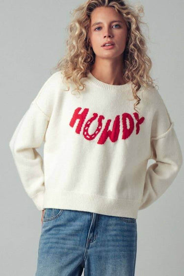 Urban Daizy Howdy Slogan Relaxed Knit Sweater featuring a casual fit and bold lettering on soft, comfortable fabric.