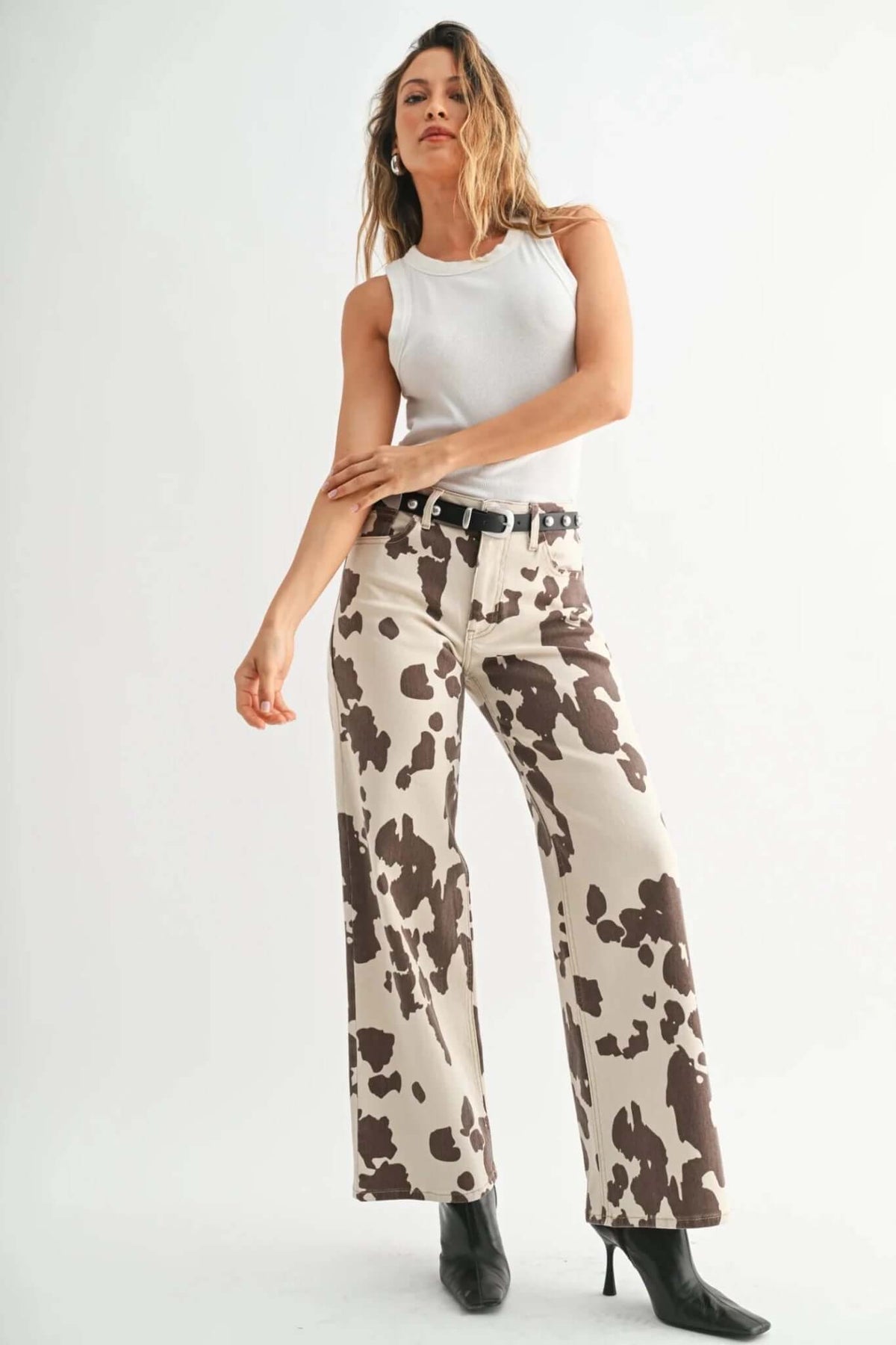 JBD Just Black Denim cow print wide leg jeans showing black denim fabric with cow pattern and relaxed fit.