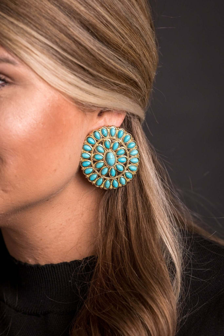 Large gold and turquoise cluster post earring by West & Co. featuring vibrant turquoise stones and a bold gold setting.