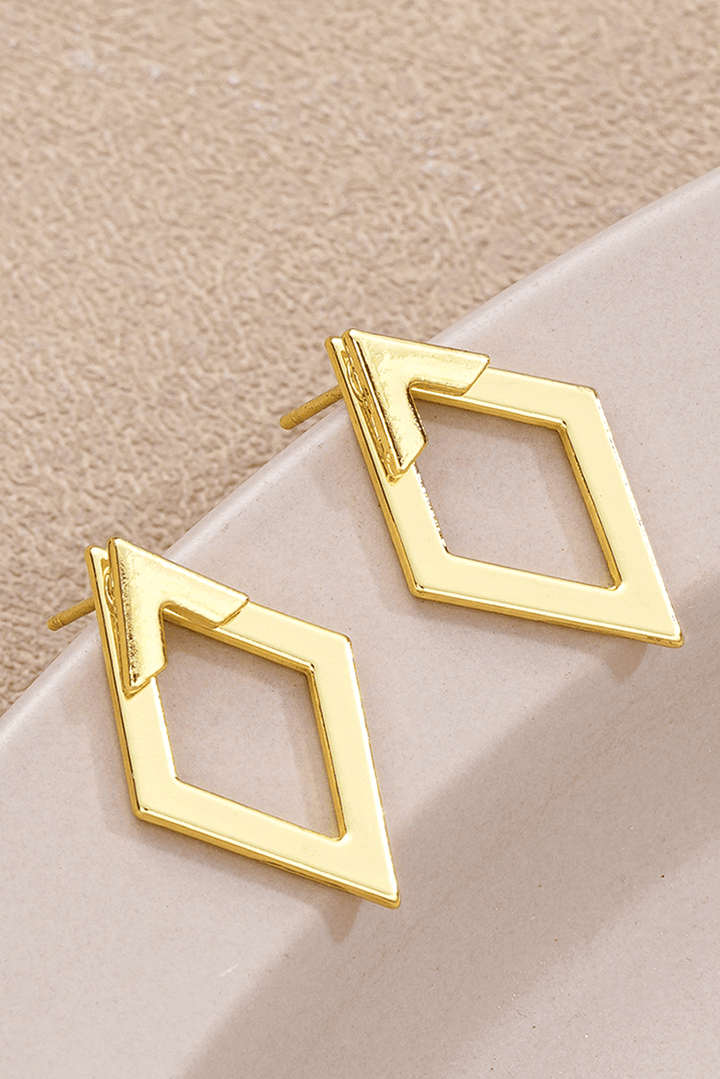Rhombus-shaped plated alloy stud earrings from Little Daisy Closet, featuring a sleek, modern geometric design.