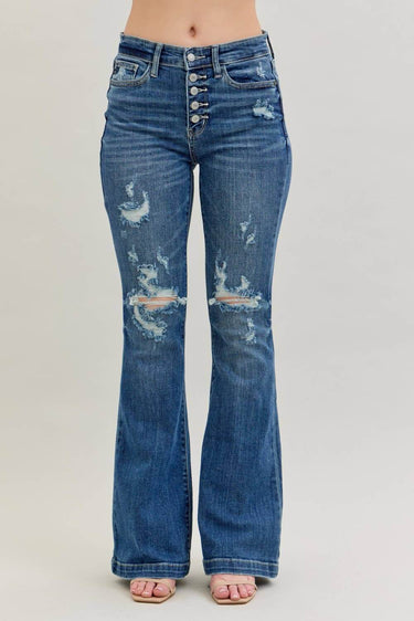 Midrise Judy Blue distressed button fly flare trousers, showcasing a stylish, distressed denim look with flared leg and classic details.
