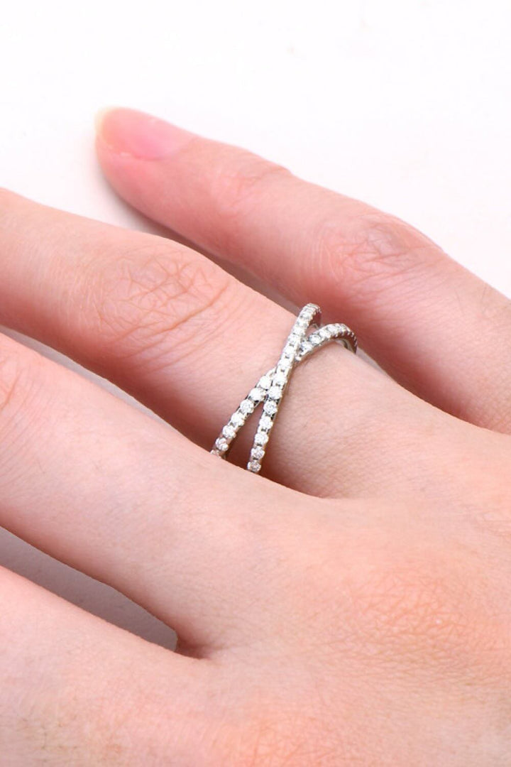 Sterling silver Moissanite crisscross ring with infinity design and 0.40 CT sparkling stones, elegant jewelry accessory.