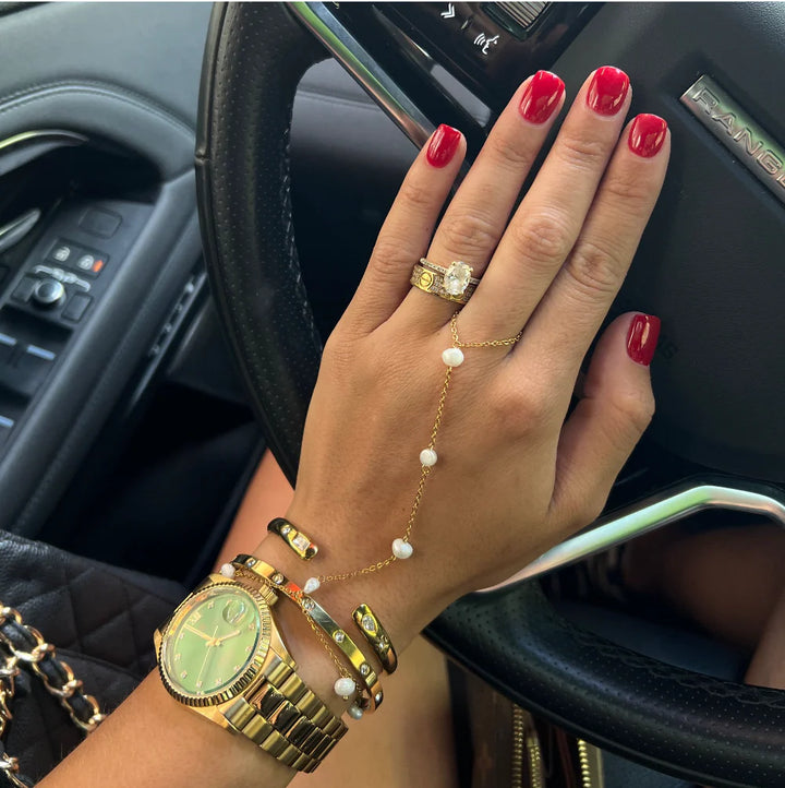 Elegant pearl hand chain by Chansuttpearls featuring white pearls and intricate design, perfect for traditional or modern jewelry styles.