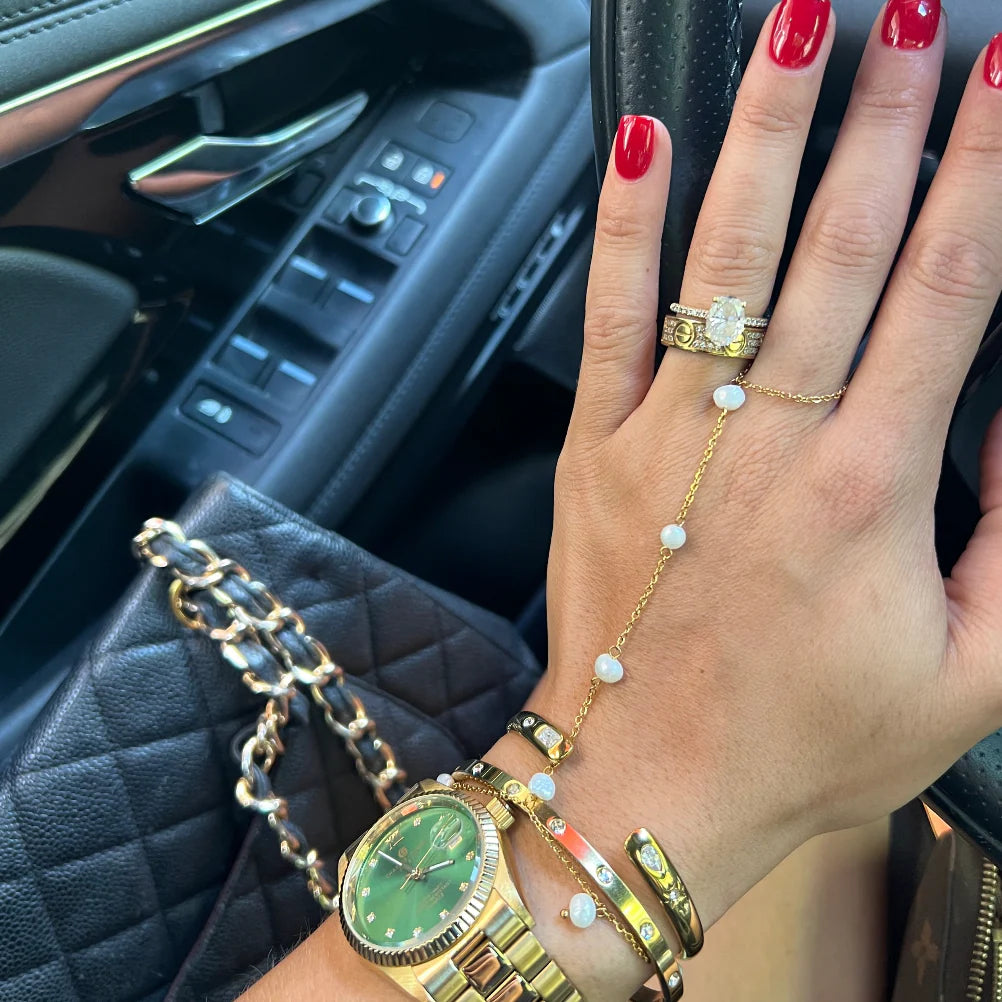 Elegant pearl hand chain by Chansuttpearls featuring a delicate design with lustrous pearls, perfect as stylish jewelry accessory.