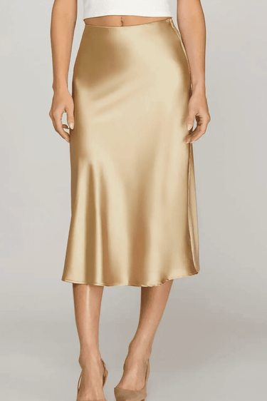 She and Sky Luxe high-waist satin midi skirt in silky fabric, showcasing smooth texture and elegant drape.