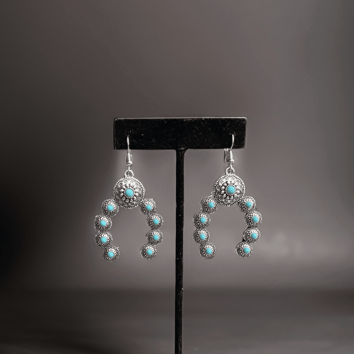 Squash Blossom Naja Western faux turquoise earrings by Westrian International, featuring traditional southwestern jewelry design