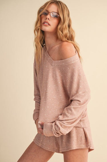 Taupe polka dot activewear top by Kimberly C, featuring a relaxed fit and stylish design for workout or casual wear.