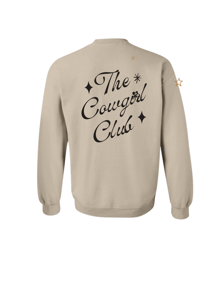 Cream-colored crewneck sweatshirt from Summer Tees with "The Cowgirl Club" graphic design on front.