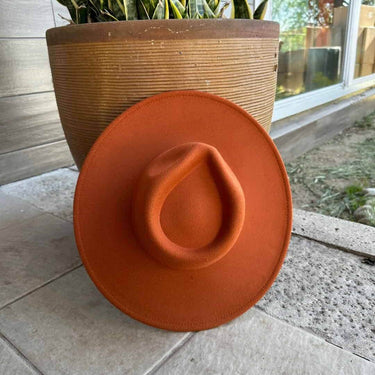 Vegan felt rancher hat by Queens INC in multiple colors, featuring a wide brim and classic cowboy style.