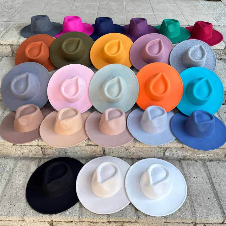 Vegan felt rancher hat by Queens INC in various colors, featuring a wide brim and classic cowboy style.