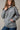 Kimes Ranch women’s Longhorn hoodie in Heather Grey, soft knit fabric with long sleeves and a relaxed fit.