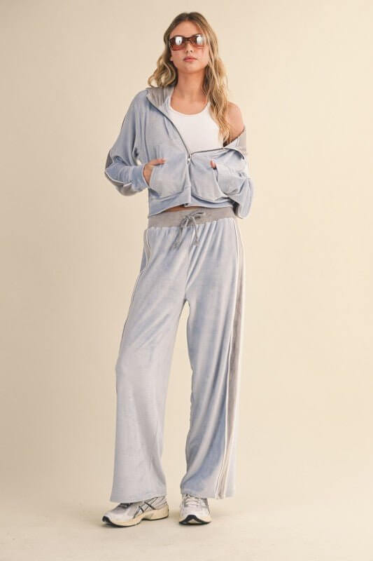 Velour tracksuit set with side stripe from Kimberly C, featuring a comfortable fit and stylish design.