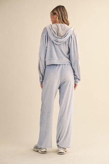 Velour tracksuit set with side stripe by Kimberly C, featuring a comfortable fit and stylish design for casual wear.