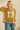 Vintage mustard floral short sleeve sweater by Sage + Fig featuring patchwork design and number 17 embroidery.