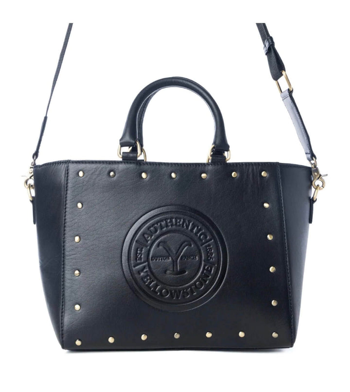 Yellowstone Legancy Studded Leather Tote by Cowgirl Charm, showcasing a stylish brown leather bag with silver stud accents.