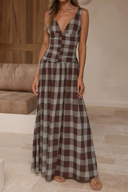 Brown plaid ruched bodice maxi dress by Sunday Up featuring a flowing skirt and fitted top with ruched detailing.