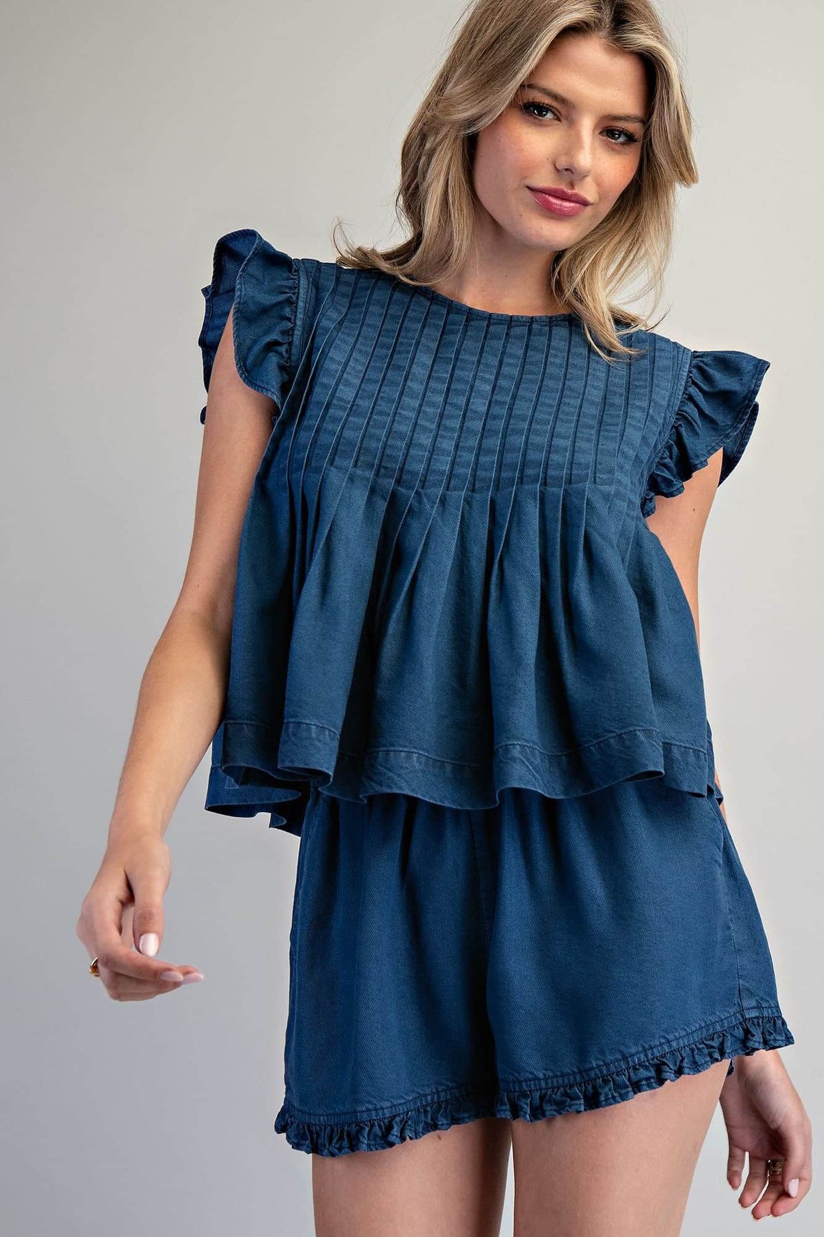 ee:some ruffled hem pintuck pleated peplum blouse featuring ruffles, pleats, and a feminine silhouette in a stylish top.