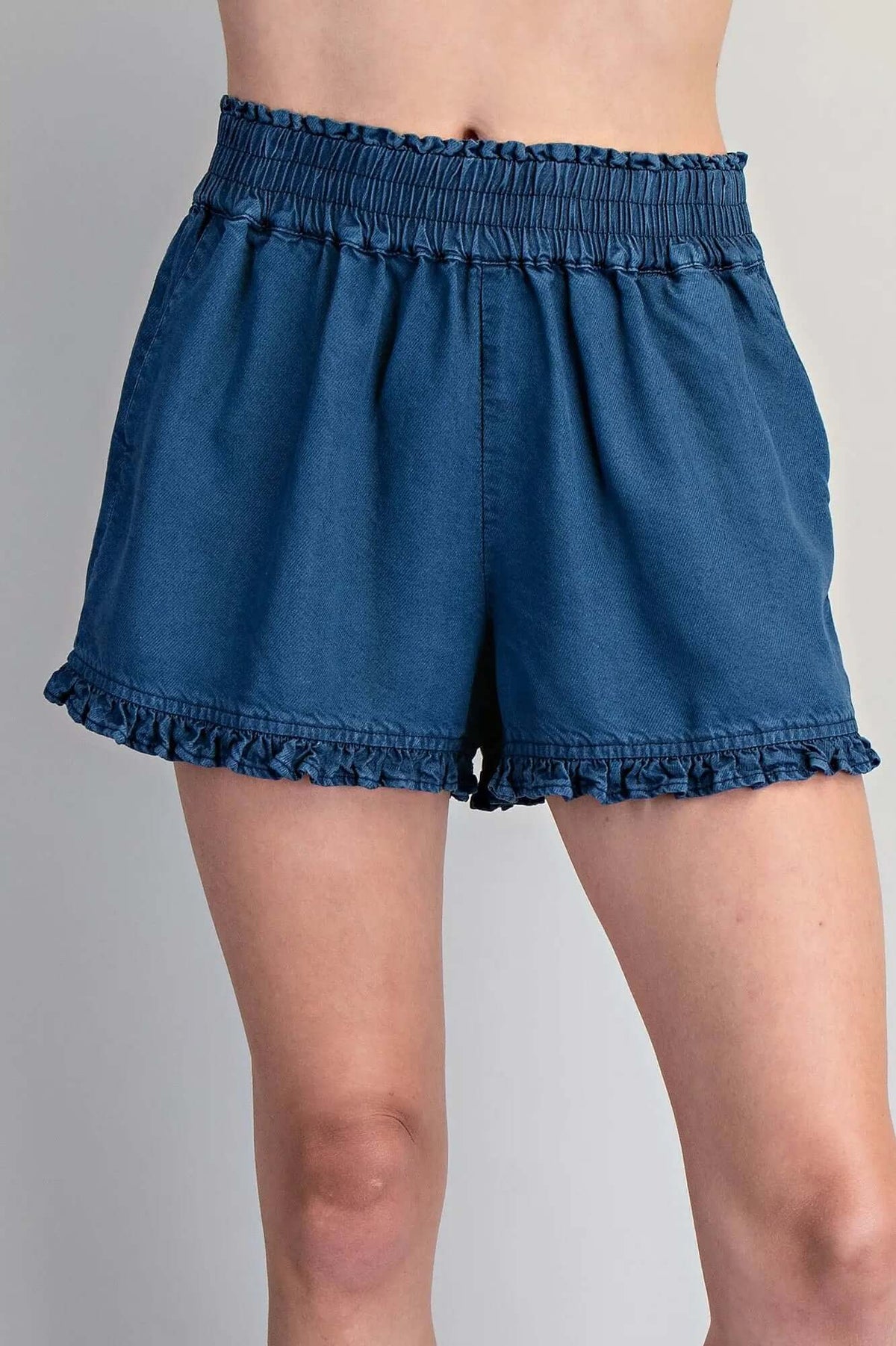 ee:some ruffled hem shorts with a relaxed fit, featuring a stylish ruffle detail at the hem for a casual summer look