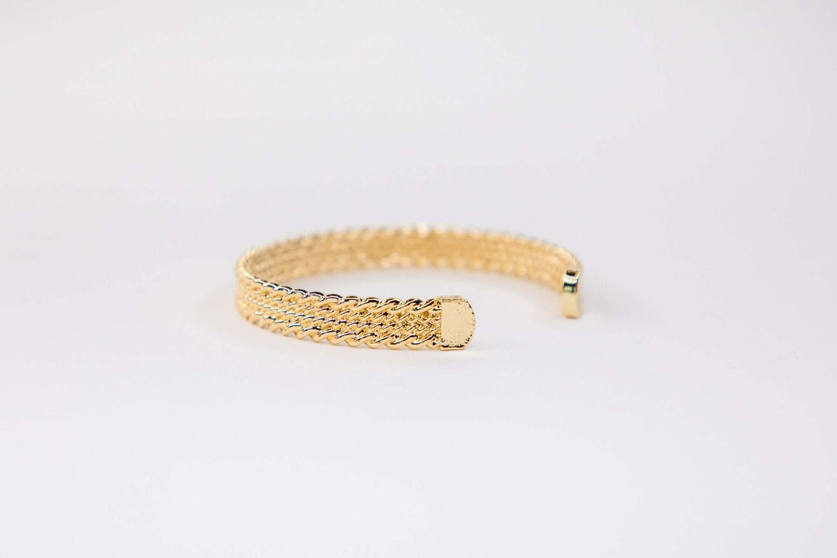 18K gold-plated 4-strand rope cuff bracelet from West & Co. showcasing layered design and elegant gold finish.