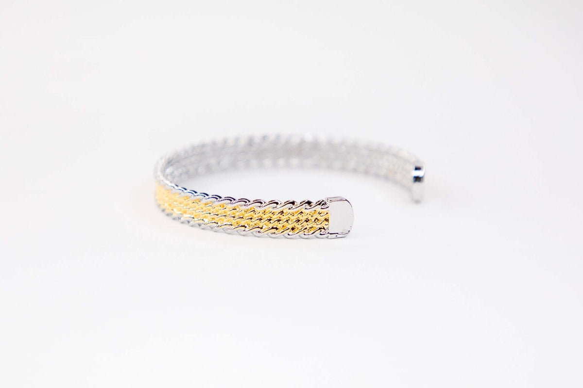 18K gold-plated 4-strand rope cuff bracelet from West & Co. showcasing layered textured design and sleek metallic finish.