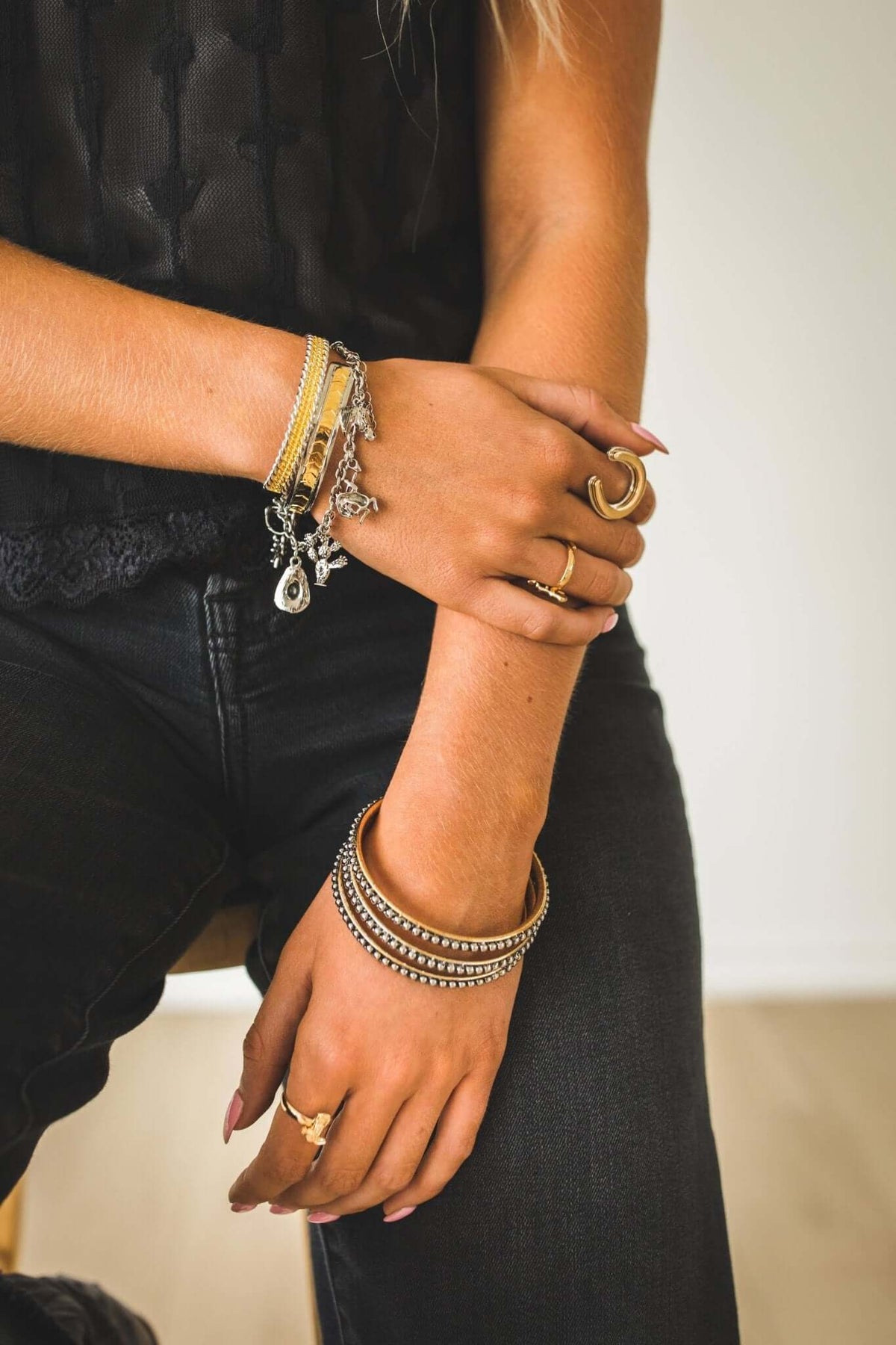 West & Co. 18K plated dotted jewelry bangle set featuring multiple slim, textured bangles for stylish accessory wear.