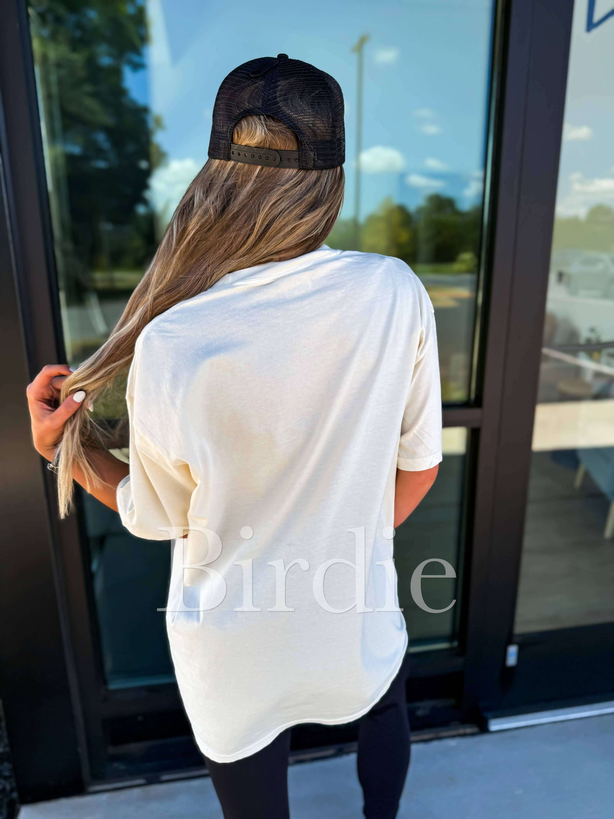 Birdie Shoulda Been A Cowghoul ivory graphic tee featuring a bold, artistic cowghoul illustration on soft cotton fabric.